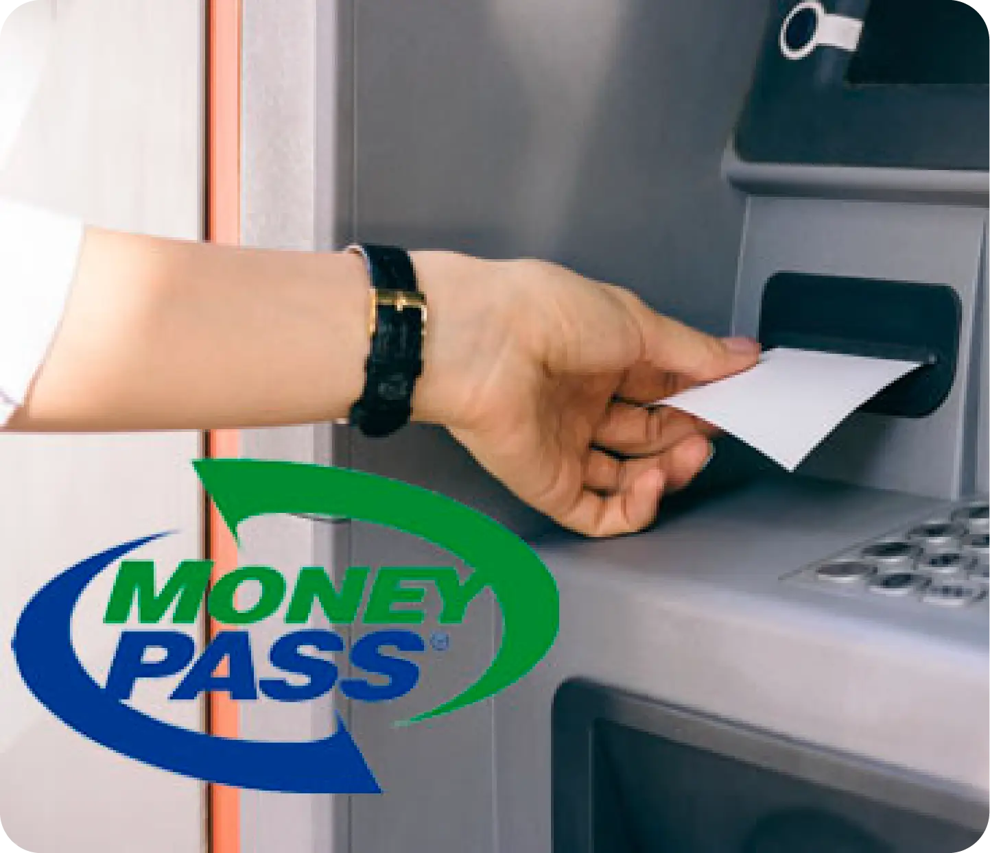 a hand inserting a piece of paper into a atm