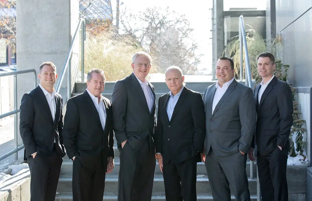 a group of men standing on stairs