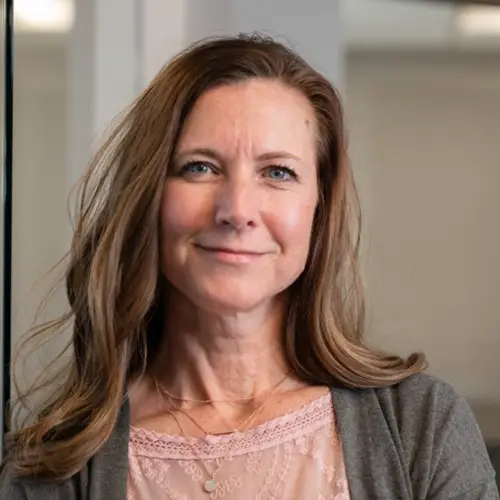 a woman smiling at the camera